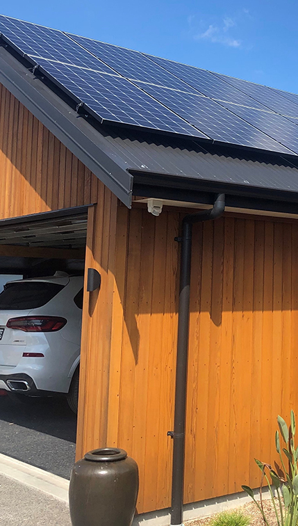 Solar panels that have been offset from council rates installed on top of a garage