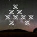 Tesla Powerwall 2 logo 'X' showin across the stars in the night sky